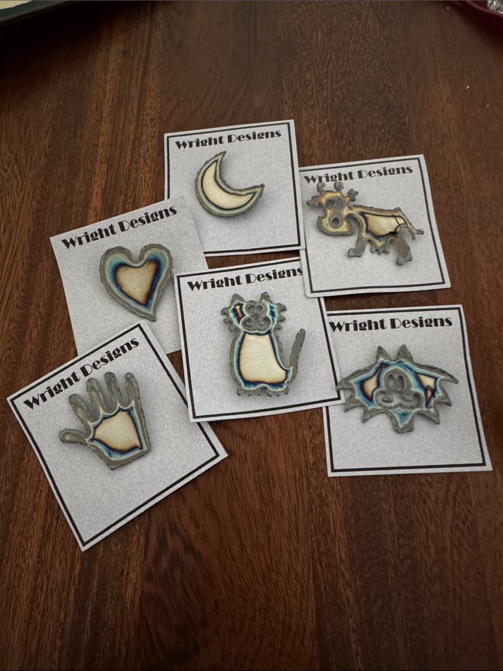 Brooches. Each piece is handcrafted. individually cut out of chrome plated steel